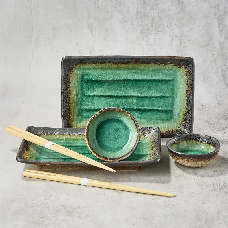 Duo rectangular sushi plates and sucking cups with assorted soy sauce Duo rectangular sushi plates and sucking cups with assorted soy sauce