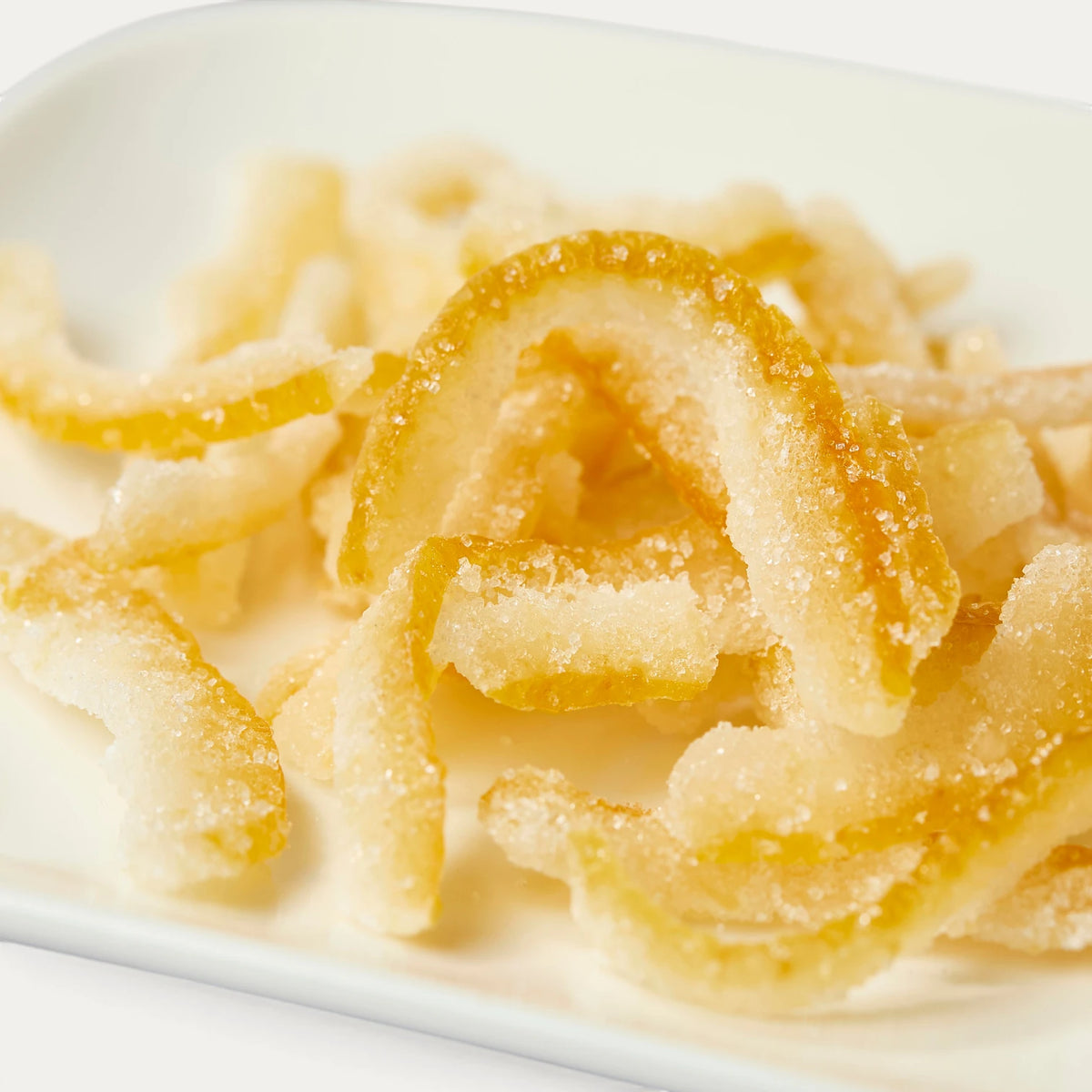 Tiras confitadas de kabosu amarillo